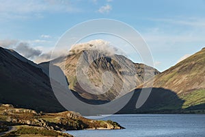 Beautiful late Summer landscape image of Wasdale Valley in Lake District, looking towards Scafell Pike, Great Gable and Kirk Fell