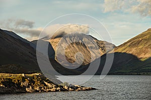 Beautiful late Summer landscape image of Wasdale Valley in Lake District, looking towards Scafell Pike, Great Gable and Kirk Fell