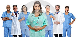 Beautiful latin american female nurse with doctor and medical team