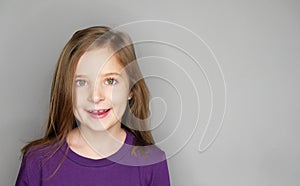 Beautiful laughing little girl; studio portrait