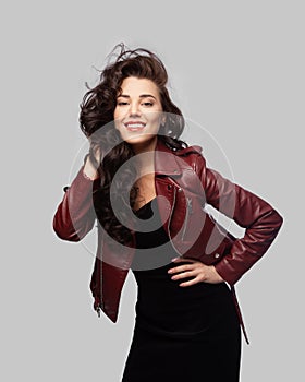 Beautiful laughing woman on a gray background