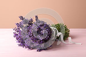 Beautiful lavender bouquet on pink wooden table