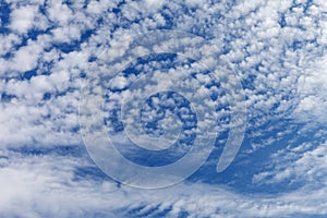Beautiful layered cumulus clouds on a blue sky background. Stratocumulus clouds