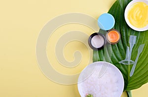 Beautiful layout of cosmetic products on a yellow background. Natural cosmetics for face and body