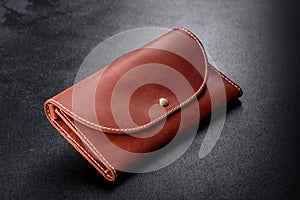 Beautiful leather brown purse made of leather to store paper money