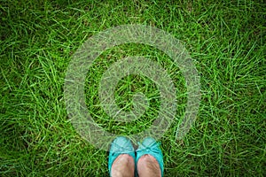 beautiful legs on the grass in the summer park