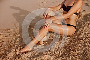 Beautiful Legs Outdoors By Beach Under Sunshine On Summer Day. Skincare. Protection Sun. Epilation Laser or Shaving Concept
