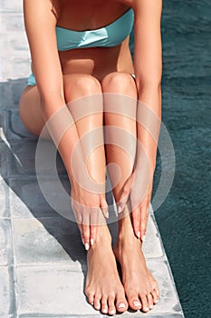 Beautiful  Legs Outdoors By Pool Under Sunshine On Summer Day. Skincare.  Protection Sun. Epilation Laser or Shaving Concept.Sunsc