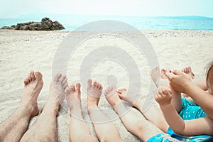 beautiful legs in the sand of the sea greece background