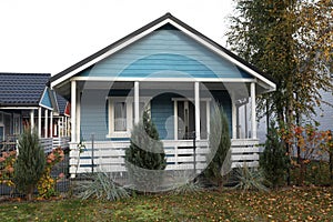 Beautiful light blue house outdoors. Real estate