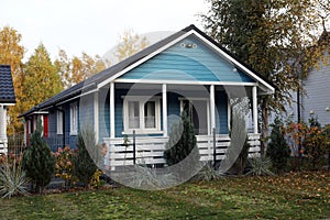 Beautiful light blue house outdoors. Real estate