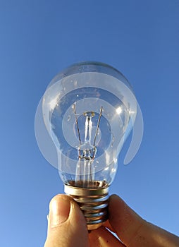 Beautiful light bulb in the river against the blue sky life freedom idea