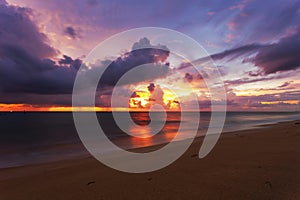 Beautiful light dramatic sky scenery over tropical sea with reflexion in the water,beautiful sunrise or sunset light of nature