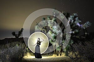 Beautiful Light Painted Girl in the Desert Trees of Joshua Tree