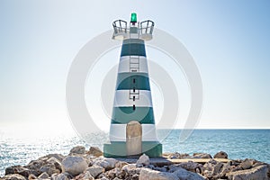 Beautiful lighthouse with calm ocean water background. sunny day outdoors