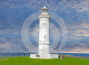 Beautiful lighthouse at Sunset over the Pacific Ocean on cliffs of Kiama Sydney NSW Australia Coastal Beach fishing Town