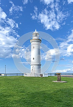 Beautiful lighthouse at Sunset over the Pacific Ocean on cliffs of Kiama Sydney NSW Australia Coastal Beach fishing Town