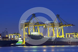 Beautiful lighting of container ship in port use for import,exp