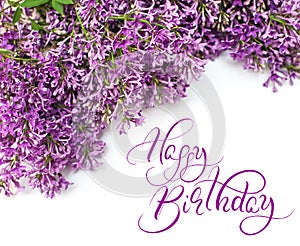 Beautiful lilac branch isolated on white background spring with text Happy Birthday. Calligraphy lettering