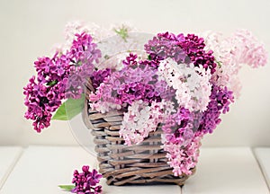 Lilac Flowers Bouquet in Wisker Basket photo