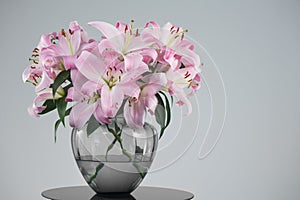 Beautiful lily flowers bouquet in a glass vase. Lillies. Pink lilies design. Big bunch of fresh fragrant lilies purple background