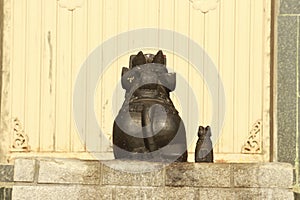 A beautiful limestone made statue of a bull in fornt of a temple in india. Indians treat the animals as god and worship them