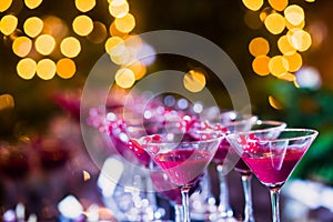 Beautiful line of different colored alcohol cocktails with smoke on a Christmas party, tequila, martini, vodka, and others on part