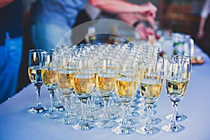 Beautiful line of different colored alcohol cocktails with smoke on a Christmas party, tequila, martini, vodka, and others on part