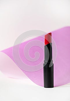 Beautiful lipstick on white background. Professional makeup product.