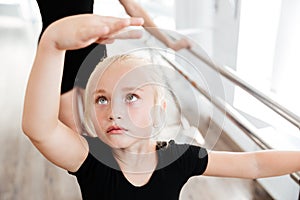 Beautiful little ballerina in ballet school