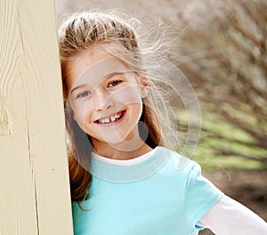 Beautiful little blond girl smiling