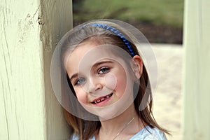 Beautiful little blond girl smiling