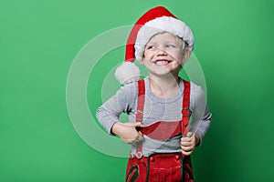 Beautiful little boy dressed like Christmas elf with big smile. Christmas concept