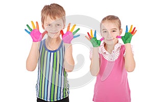 Beautiful little boy and girl with hands in the paint
