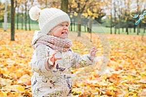 Beautiful little girl in the autumn park