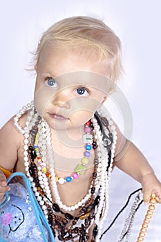 Beautiful little girl with beads