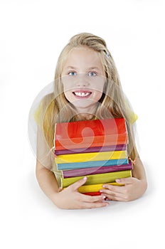 Beautiful little girl with the colorful books. Isolated on a white background