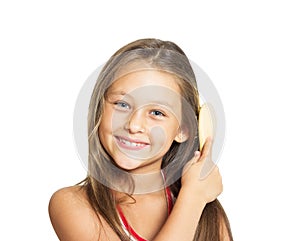 Beautiful little girl combing