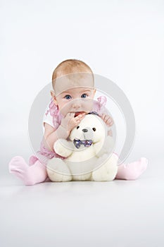 Beautiful little girl with cuddle-bear.