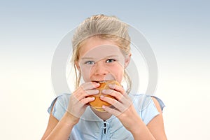 Beautiful Little Girl Eating A Cheeseburger