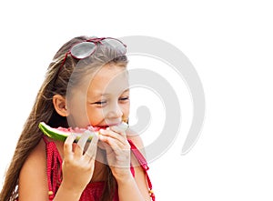 Beautiful little girl eating juicy watermelon