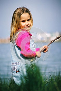 Beautiful little girl fishing