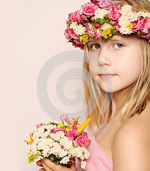 Beautiful little girl with flowers