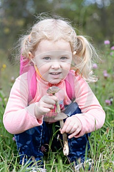 Beautiful little girl found mushrooms