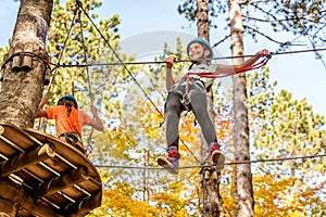 Beautiful little girl having fun in adventure Park, Montenegro