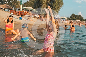 Beautiful little girl having fun in water