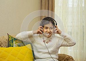 Beautiful little girl listening to music