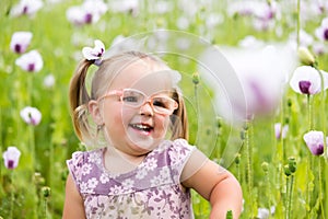 Beautiful little girl on a meadow