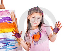 Beautiful little girl painting with her hands