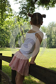 Beautiful little girl posing in a mini skirt